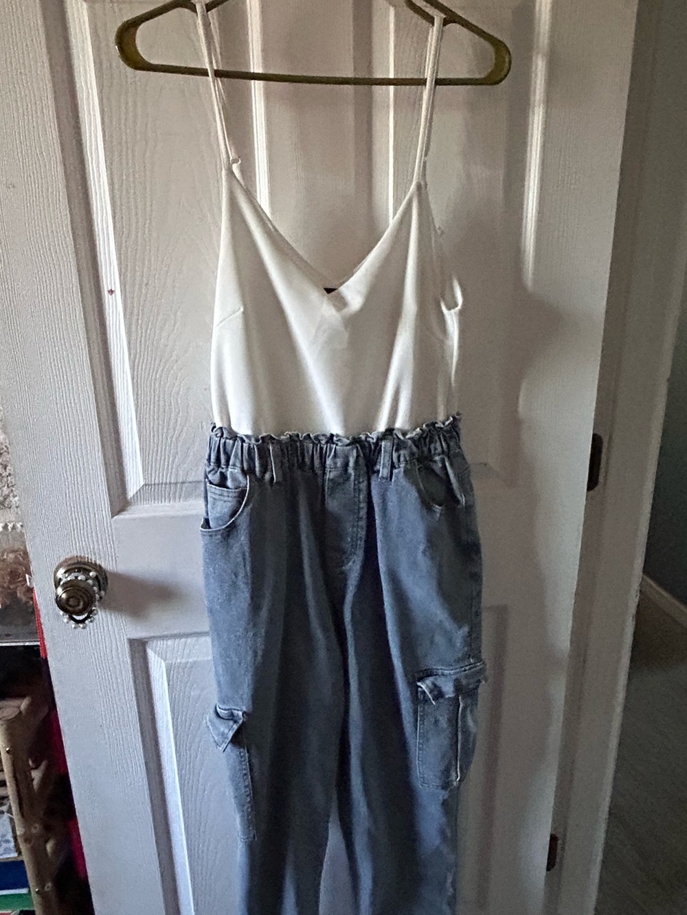 Denim jumpsuit with cargo pockets and adjustable straps